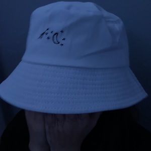 White bucket hat with stars and a moon
